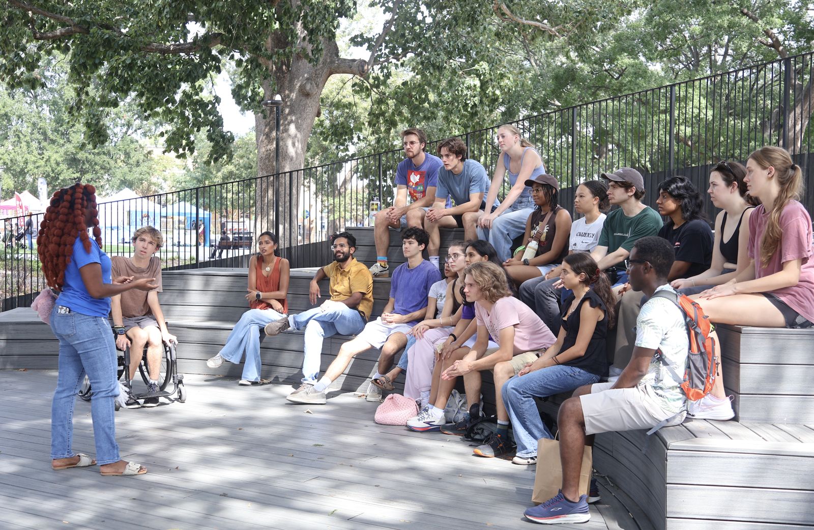 The group listening together on the steps